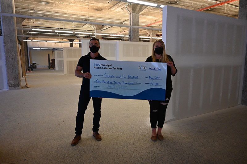 Cheque photo, people holding large cheque, cedc tourism