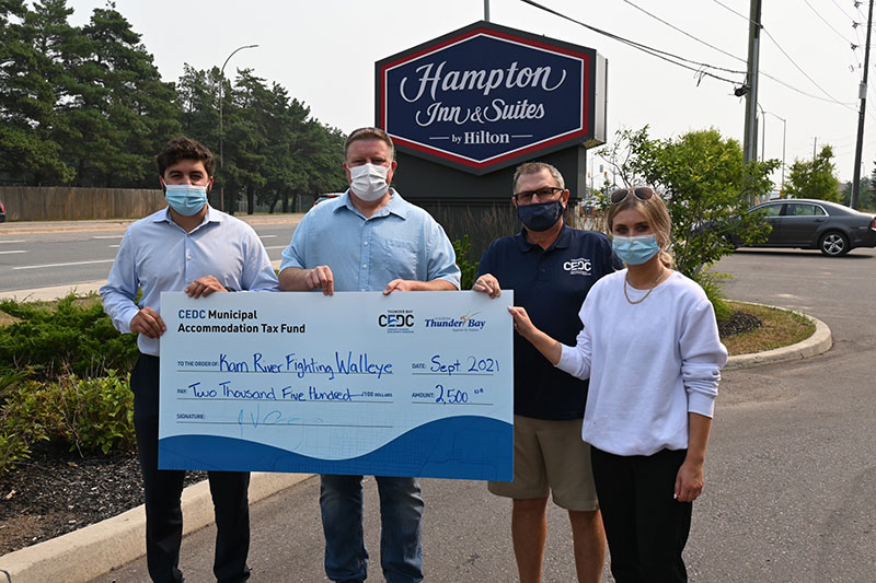 Cheque photo, people holding large cheque, cedc tourism