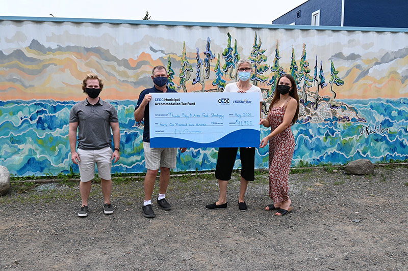 Cheque photo, people holding large cheque, cedc tourism
