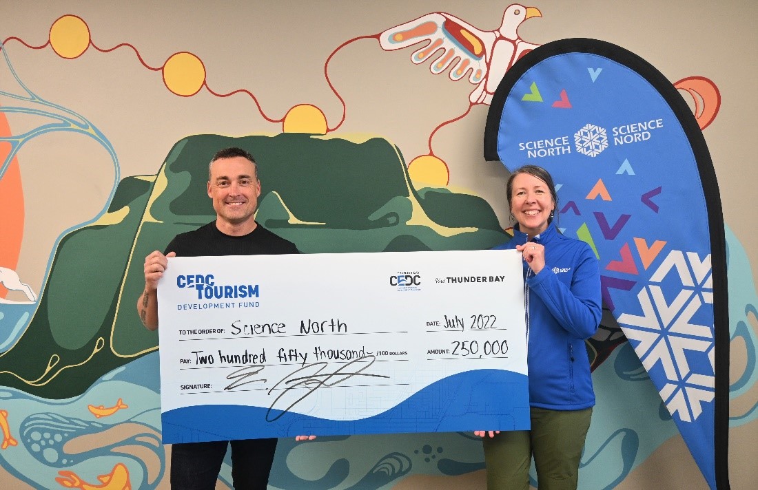 Cheque photo, people holding large cheque, cedc tourism