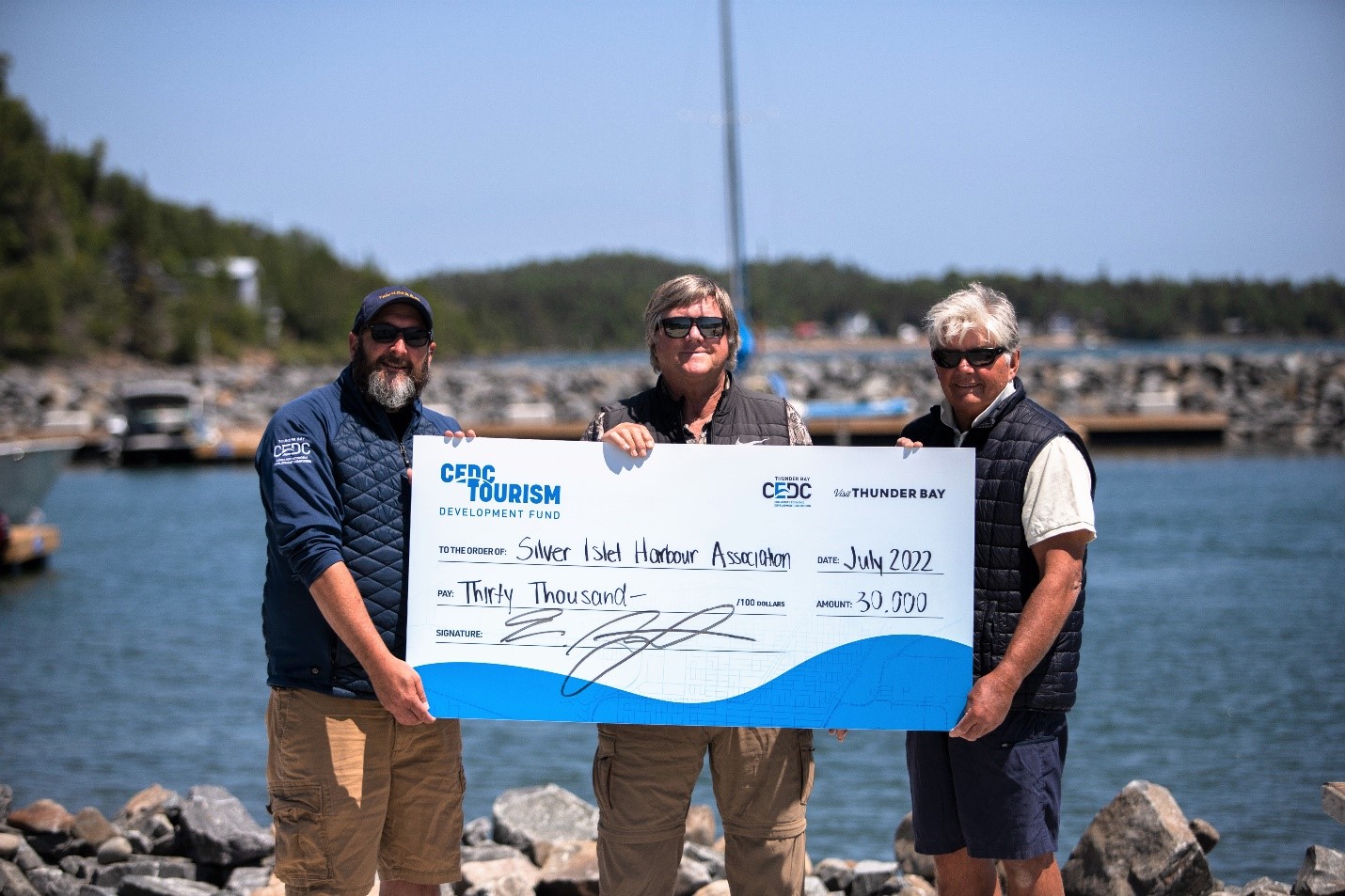 Cheque photo, people holding large cheque, cedc tourism