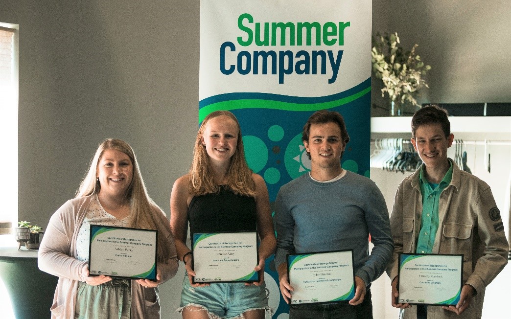 Summer company students holding their certificates