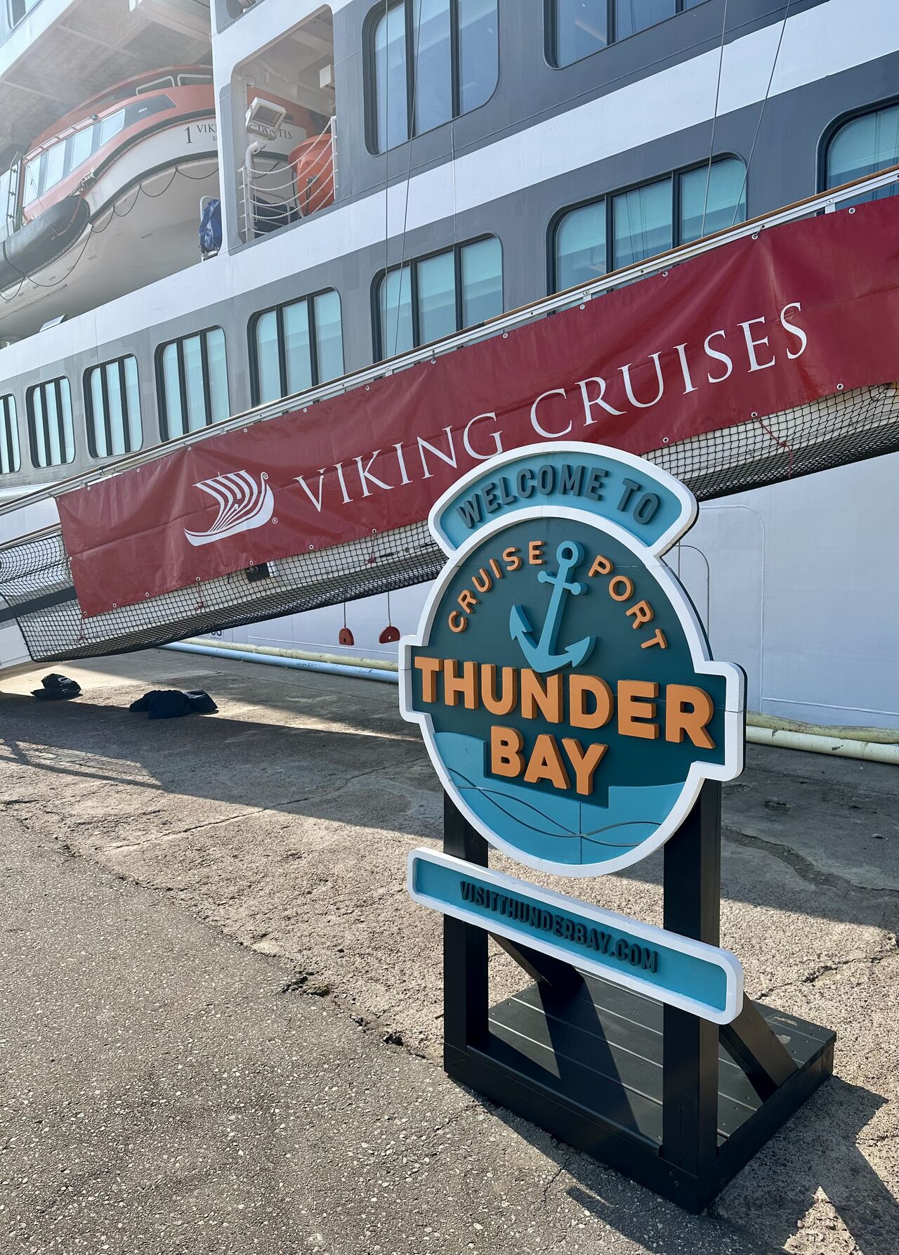 Welcome to Thunder Bay Cruise Port sign a the Thunder Bay Port where there is a viking cruise ship docked