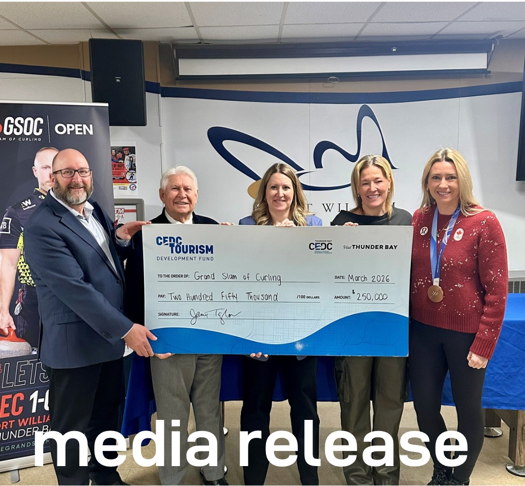 Groups of people holding large cheque for funding amount